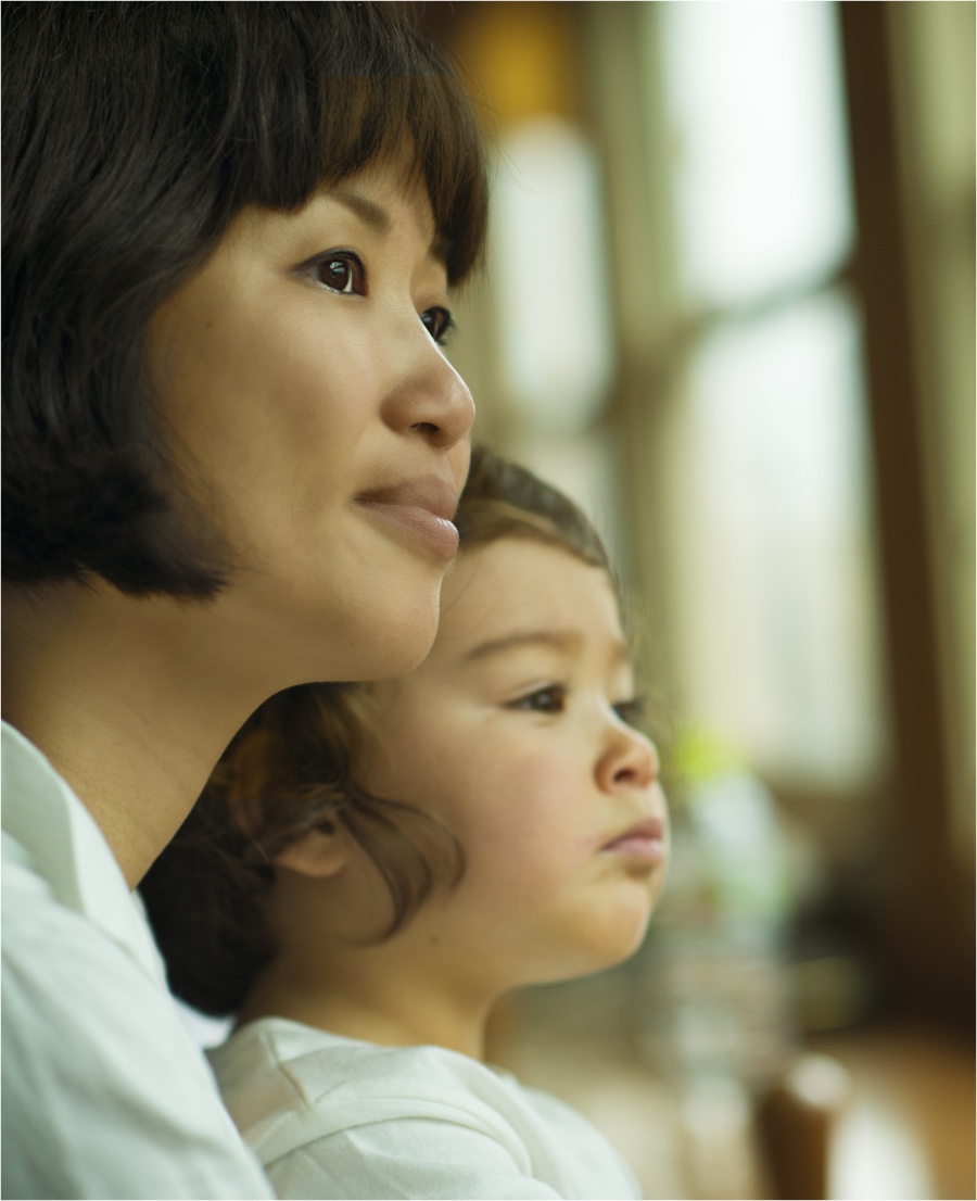 Woman and child looking out the window